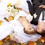bride-and-groom-lying-in-leaves (Small)